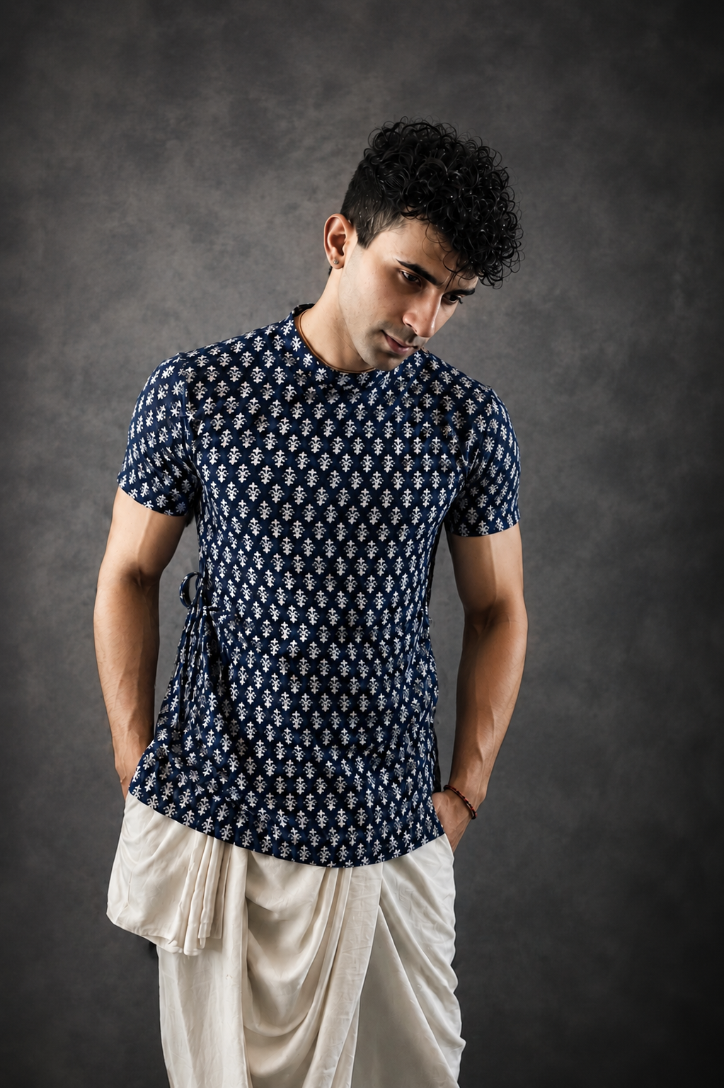 Model wearing a navy printed kurta and white dhoti